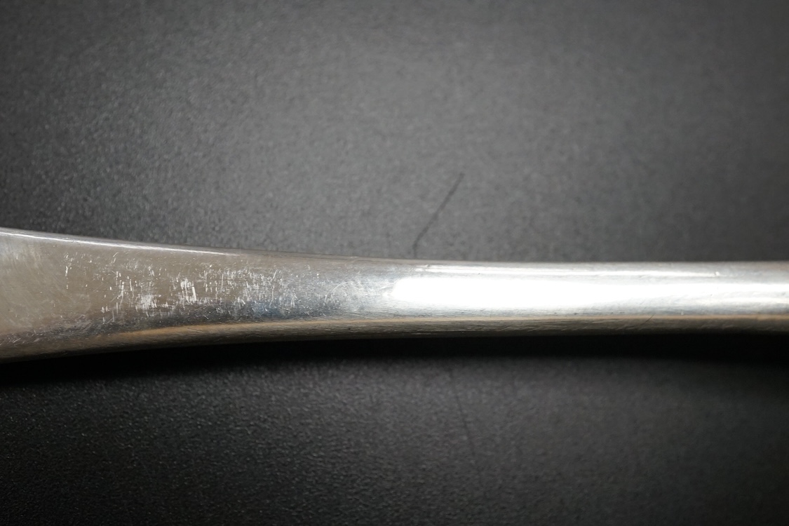A Queen Anne Britannia standard silver dog nose spoon, indistinct maker's mark, London, 1704, with rat-tail bowl and later? engraved crest, 19.8cm, 63 grams.